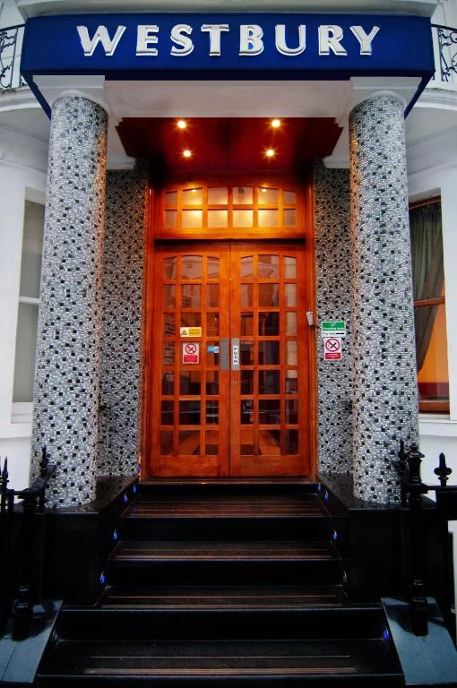 Westbury Hotel London entrance with iconic Westbury signage and welcoming wooden doors